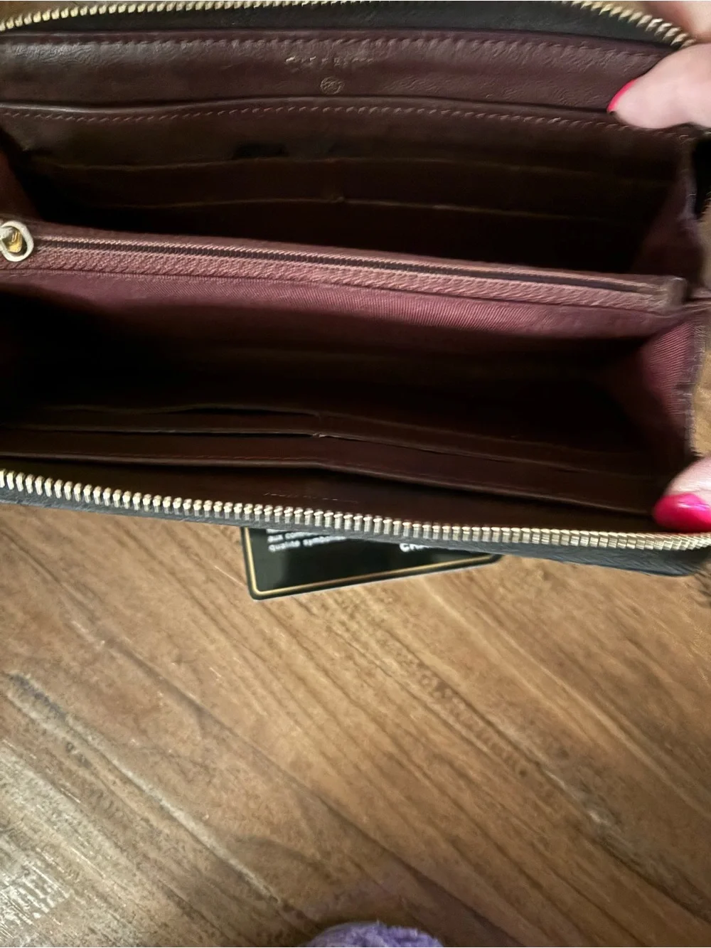 CHANEL Black Quilted Zip Around Wallet with Gold CC